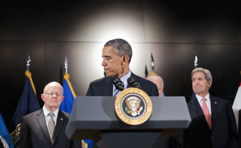 President Barack Obama, accompanied by, from left, Office of National Intelligence Director James Clapper, Vice President Joe Biden, and Secretary of State John Kerry, walks away from the podium after speaking at the National Counterterrorism Center in McLean, Va.,Thursday, Dec. 17, 2015. The president said U.S. intelligence and counter-terrorism professionals don't have any specific, credible information suggesting a terrorist attack on the U.S. during the holidays. (AP Photo/Pablo Martinez Monsivais)