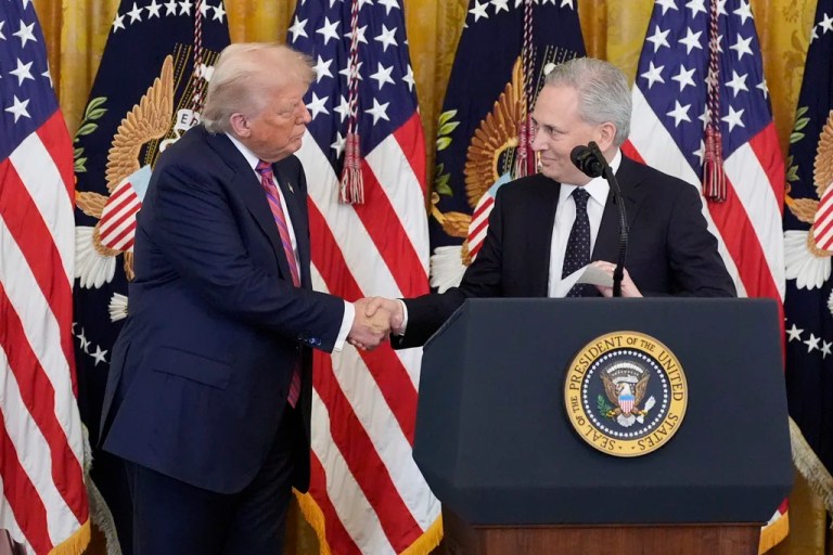 White House AI and crypto czar David Sacks, right, shakes the hand of President Donald Trump at an event for the signing of the GENIUS Act, a bill that regulates stablecoins, a type of cryptocurrency, in the East Room of the White House, Friday, July 18, 2025, in Washington. (AP Photo/Alex Brandon)