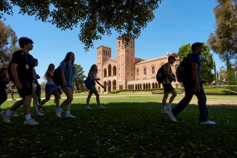 Students walk past Royce Hall at the University of California, Los Angeles, campus.