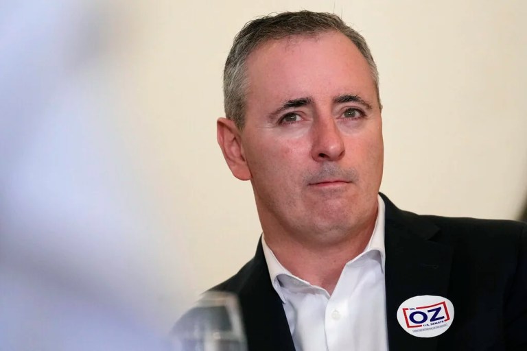 Brian Fitzpatrick listens during a campaign event for Mehmet Oz