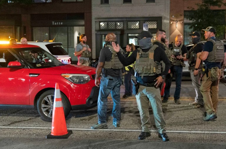 Immigration and Customs Enforcement's Homeland Security Investigations agents join Washington Metropolitan Police Department officers as they conduct traffic checks at a checkpoint along 14th Street in northwest Washington, Wednesday, Aug. 13, 2025.