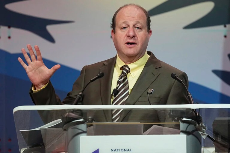 Colorado Governor Jared Polis speaks during the summer meeting of the National Governors Association at the Broadmoor Hotel in Colorado Springs, Colo.
