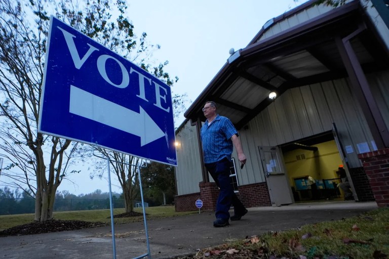A voter leaves a polling location after voting Tuesday, Nov. 5, 2024, in Rutledge, Georgia.