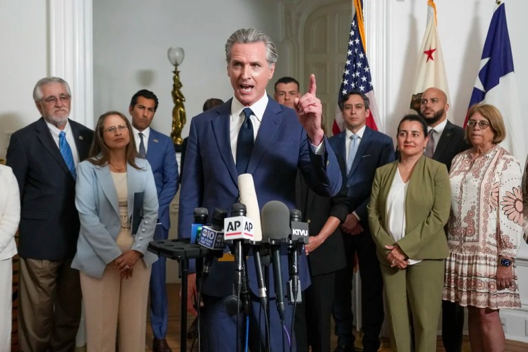 Accompanied by California and Texas lawmakers, California Gov. Gavin Newsom, center, discusses the push to schedule a special election to redraw California's Congressional voting districts, during a news conference in Sacramento, Calif., Friday Aug. 8, 2025.
