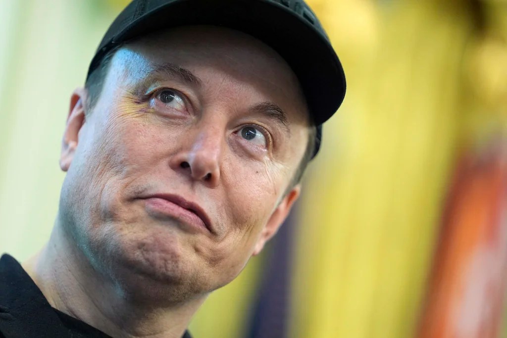Elon Musk listens as President Donald Trump speaks during a news conference in the Oval Office of the White House, Friday, May 30, 2025, in Washington.