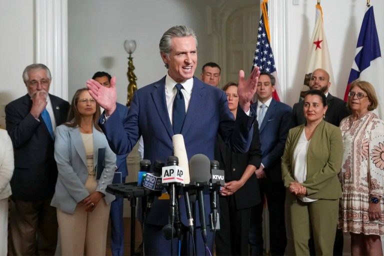 Accompanied by California and Texas lawmakers, California Gov. Gavin Newsom, center, discusses the push to schedule a special election to redraw California's Congressional voting districts.