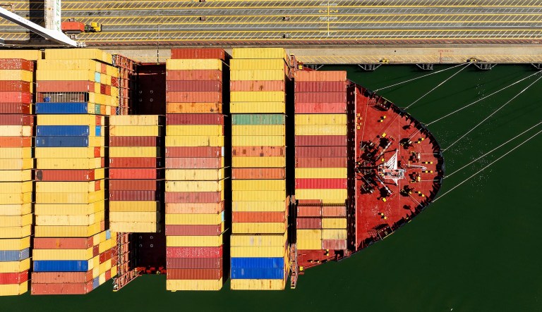 Cargo containers line a ship at the Port of Oakland on Wednesday, Aug. 6, 2025, in Oakland, Calif.