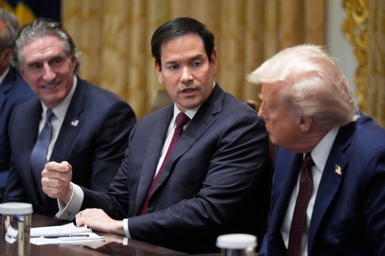 President Donald Trump listens as Secretary of State Marco Rubio speaks. Interior Secretary Doug Burgum sits on the left.