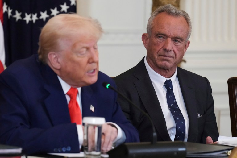President Donald Trump speaks as Health and Human Services Secretary Robert F. Kennedy Jr. listens.