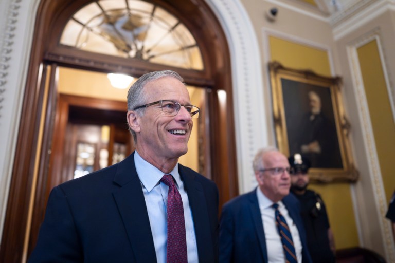 Senate Majority Leader John Thune, R-S.D., is met by reporters as he walks to his office while Congress works on a government funding solution, at the Capitol in Washington, Thursday, Sept. 18, 2025.