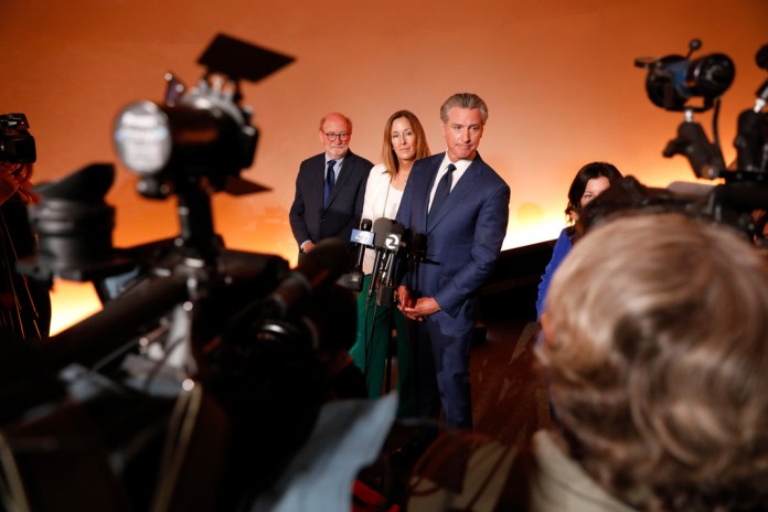 Governor Gavin Newsom answers questions from the media after speaking at a event where he announced signing a package of climate and energy bills on Friday, September 19, 2025 in San Francisco.