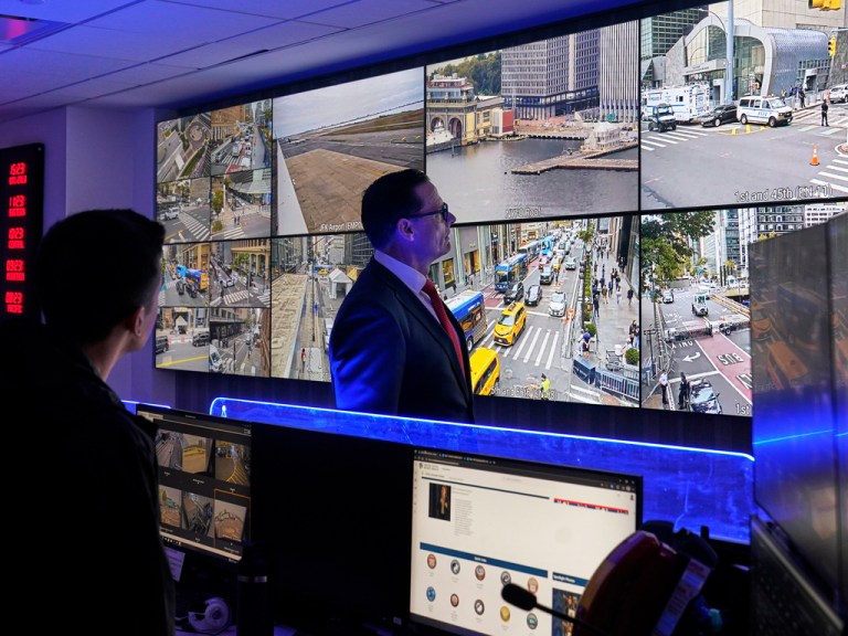 Secret Service Special Agent in Charge Matt McCool looks at surveillance footage.