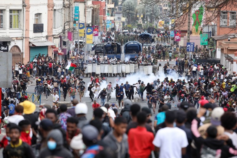 Demonstrators protesting against chronic electricity and water cuts confront riot police.