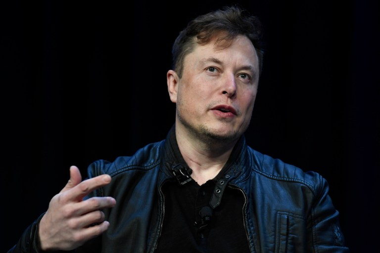 FILE - Tesla and SpaceX CEO Elon Musk speaks at the SATELLITE Conference and Exhibition in Washington, March 9, 2020. An air quality board has ordered electric car manufacturer Tesla to stop illegally polluting the air in the San Francisco Bay Area. (AP Photo/Susan Walsh, File)