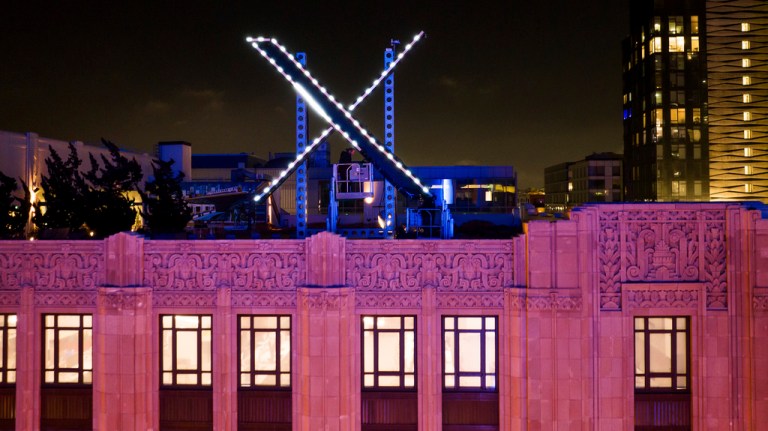 Workers install lighting on an 