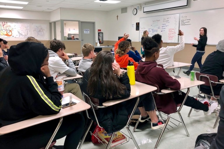 Instructors from Raphael House lead a classroom discussion.