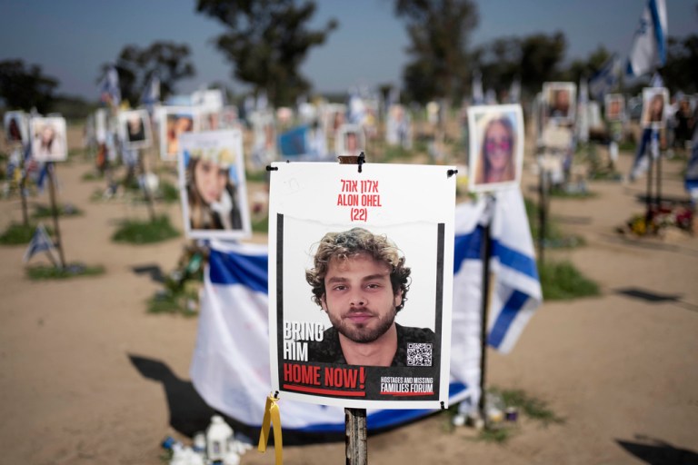 FILE - A poster depicting Israeli hostage Alon Ohel is displayed in Re'im, southern Israel, at the Gaza border, Feb. 26, 2024, at a memorial site for the Nova music festival site where he was kidnapped by Hamas on Oct. 7, 2023. (AP Photo/Maya Alleruzzo, File)