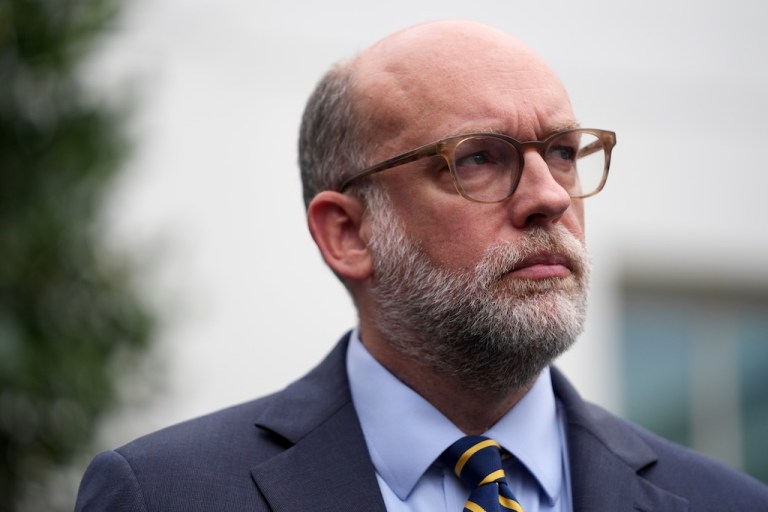 Russell Vought, Office of Management and Budget director, listens as he addresses members of the media outside the West Wing of the White House.