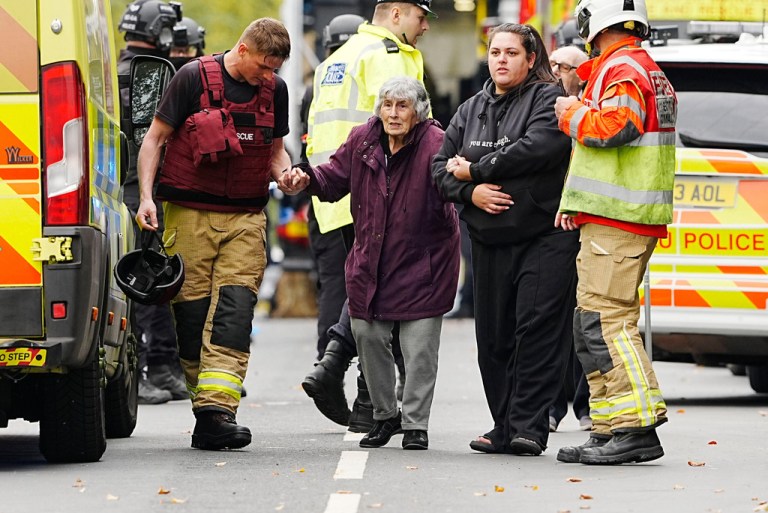 A member of the public is helped from the scene of a stabbing incident at Heaton Park Hebrew Congregation synagogue, in Crumpsall, Manchester, England, Thursday Oct. 2, 2025.