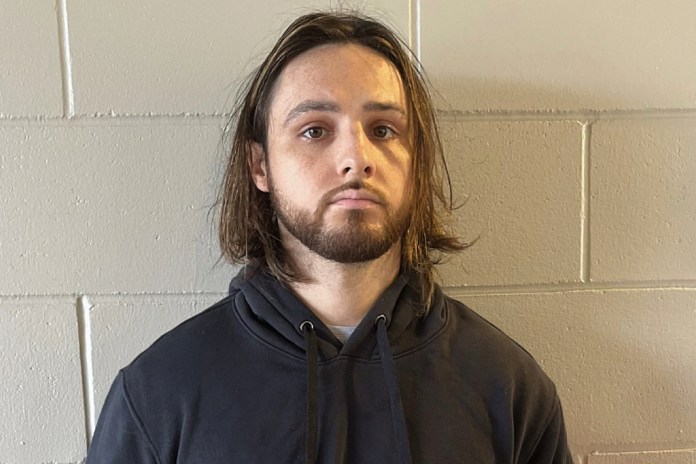This undated photo provided by the US Attorney's Office shows Jonathan Rinderknecht