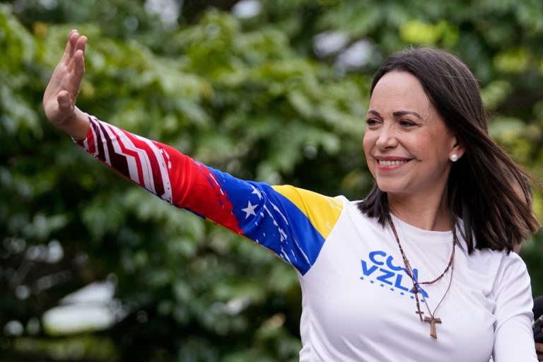Opposition leader Maria Corina Machado waves