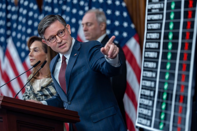Speaker of the House Mike Johnson, R-La., points to a chart tracking the votes and failures on the Republican funding bill, during a news conference on day 29 of the government shutdown, at the Capitol in Washington, Wednesday, Oct. 29, 2025. (AP Photo/J. Scott Applewhite)