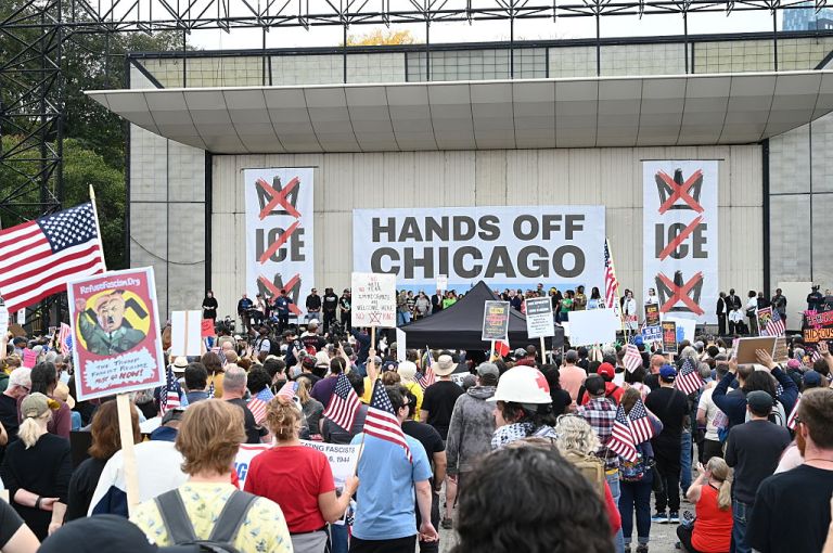 Demonstrators gather at Butler Field in Grant Park for the 