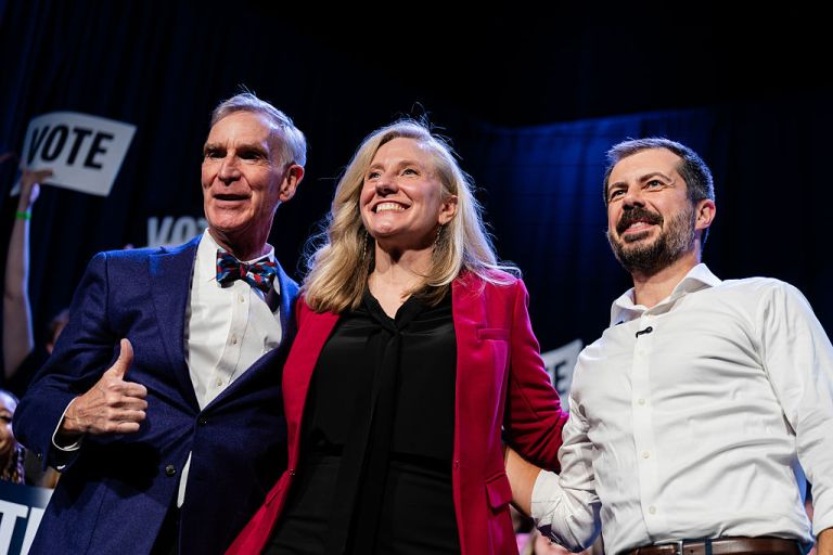 Bill Nye, chief executive officer of the Planetary Society, from left, former Representative Abigail Spanberger, Democratic gubernatorial candidate for Virginia, and Pete Buttigieg, former US secretary of transportation, during a campaign event at the Jefferson Theater in Charlottesville, Virginia, US, on Tuesday, Oct. 21, 2025. Spanberger will face off with Winsome Earle-Sears this November, giving the state its first female governor. Photographer: Carlos Bernate/Bloomberg via Getty Images