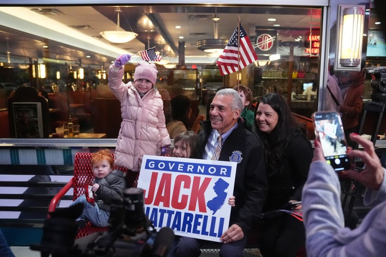Republican candidate for governor of New Jersey Jack Ciattarelli poses with supporters at a campaign stop.