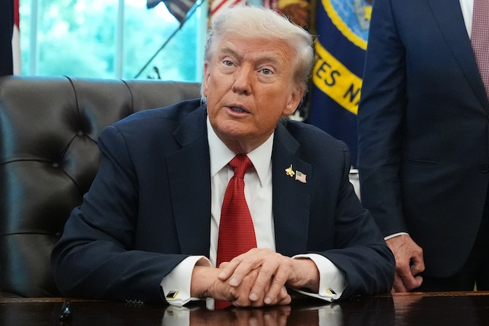 President Donald Trump speaks to reporters