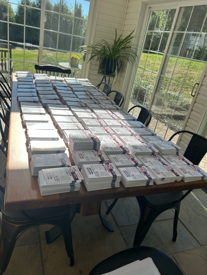 Stacks of nearly 10,000 postcards going to Amish voters who made an impact in the 2024 elections in Pennsylvania for president, Senate, all three statewide, elected row offices, and two congressional races.