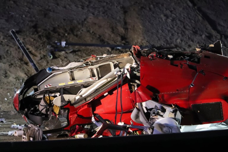 A medical helicopter is shown after it crashed on Highway 50 on Monday, Oct. 6, 2025, in Sacramento, CA. (AP Photo/Scott Marshall)