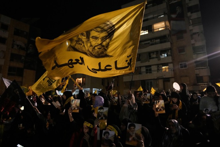 A flag flies honoring a former Hezbollah leader.