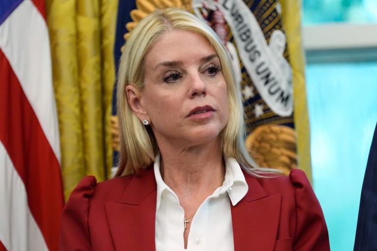 Bondi looks on in the Oval Office.
