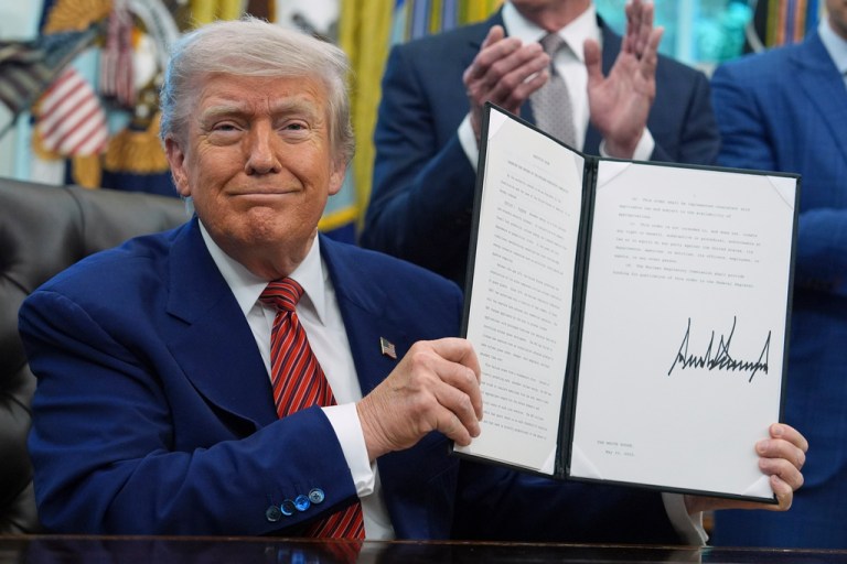 President Donald Trump holds an executive order regarding the reform of the Nuclear Regulatory Commission in the Oval Office of the White House, May 23, 2025, in Washington. (AP Photo/Evan Vucci, File)