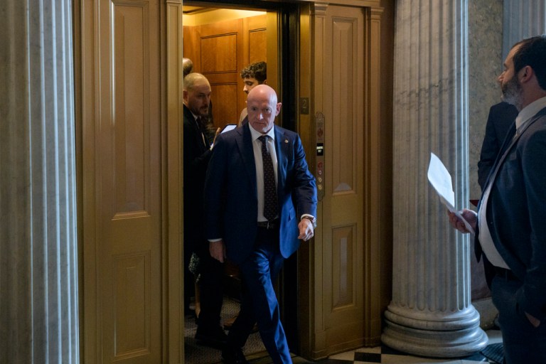 Sen. Mark Kelly (D-AZ) walks to the Senate chamber.