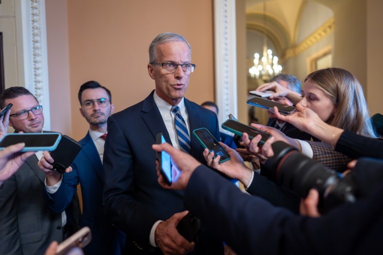 John Thune speaking with reporters.