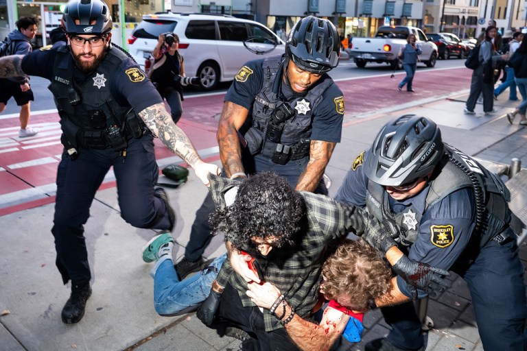 Protester arrested outside of TPUSA rally.