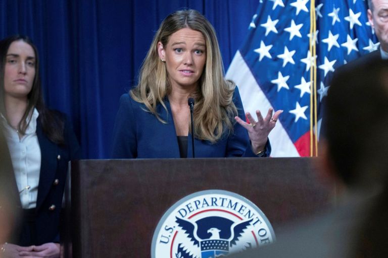 DHS Assistant Secretary Tricia McLaughlin speaks from the podium.
