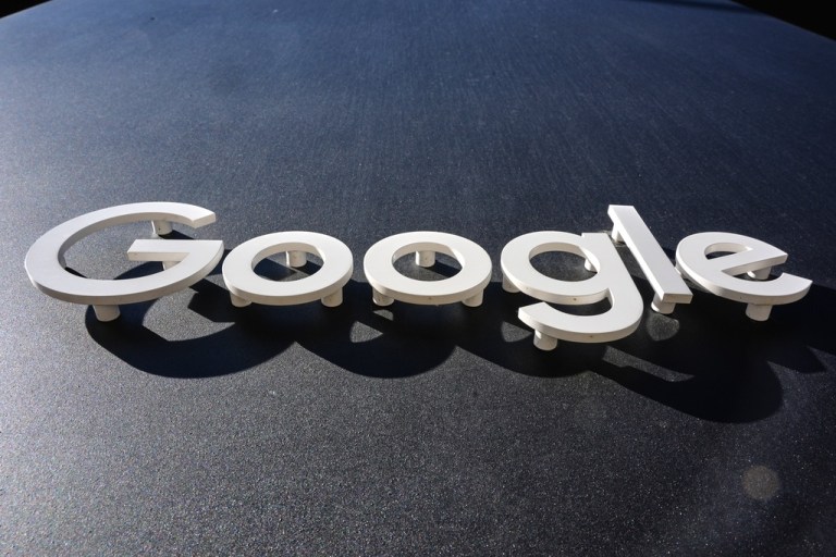 The Google logo sticks out of a building in New York