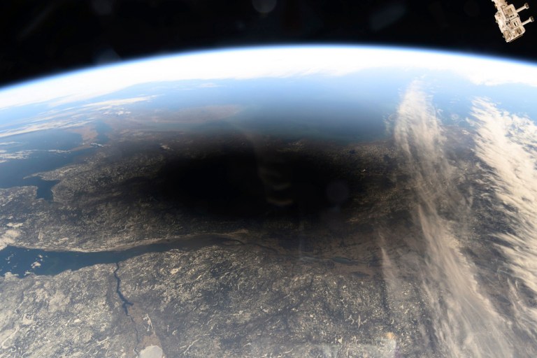 The Moon's shadow covering portions of Canada and the U.S. during a total solar eclipse.