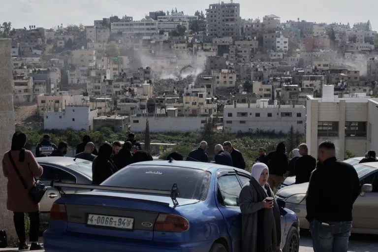 Israeli army bulldozer demolishing homes in the Palestinian urban refugee camp