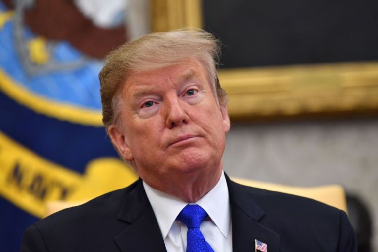US President Donald Trump speaks in the Oval office of the White House in Washington, DC, on February 13, 2019. - Trump hosted his Colombian counterpart, Ivan Duque, at the White House on Wednesday to discuss their campaign to pressure Venezuela's far left president, Nicolas Maduro, from power. The Trump-Duque talks in the Oval Office, followed by lunch, will give the allies a chance to compare notes just as the standoff between Maduro and opposition leader Juan Guaido heats up over the arrival of mostly US aid shipments. (Photo by Nicholas Kamm / AFP) (Photo by NICHOLAS KAMM/AFP via Getty Images)