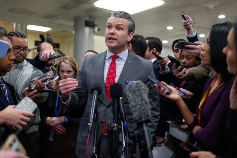 Secretary of War Pete Hegseth speaks to the press.