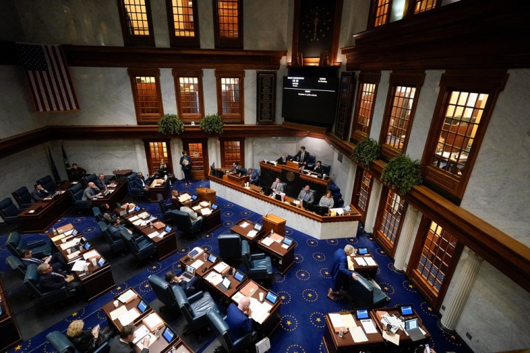 Senators meet in the Senate chamber at the Statehouse in Indianapolis.