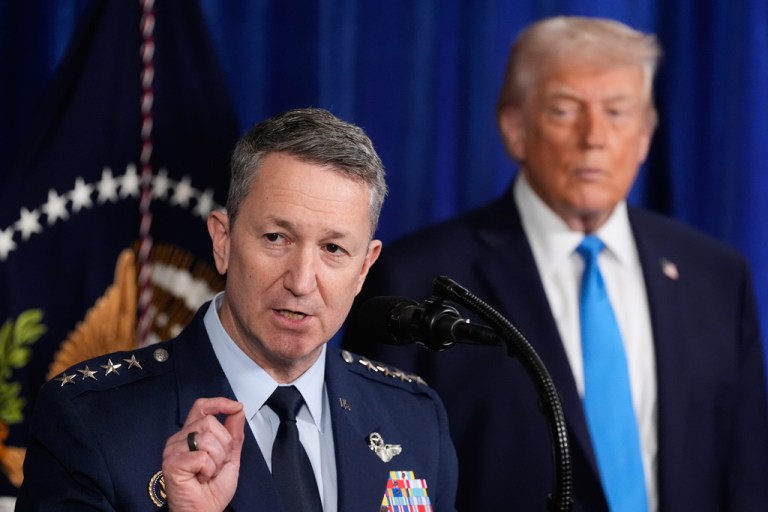 President Donald Trump listens as Chairman of the Joint Chiefs of Staff Gen. Dan Caine speaks at Mar-a-Lago, Saturday, Jan. 3, 2026, in Palm Beach, Fla.