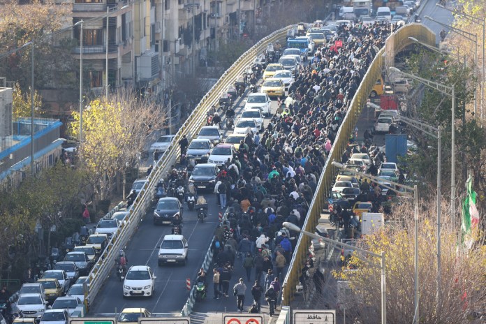 Iranian protesters march through Tehran