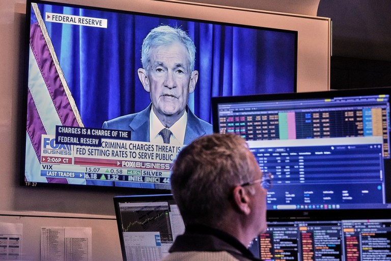 A video of Federal Reserve Chair Jerome Powell plays on a screen on the floor of the New York Stock Exchange, Monday, Jan. 12, 2026. (AP Photo/Richard Drew)