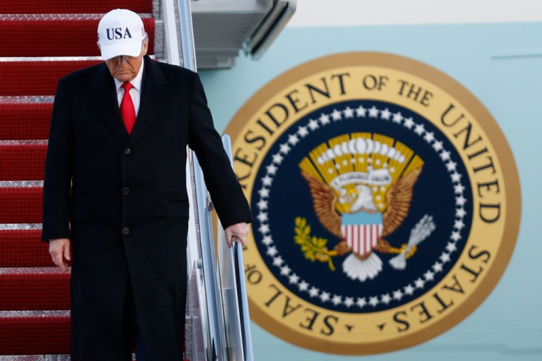 President Donald Trump walks down the stairs of Air Force One upon his arrival at Joint Base Andrews, Maryland.
