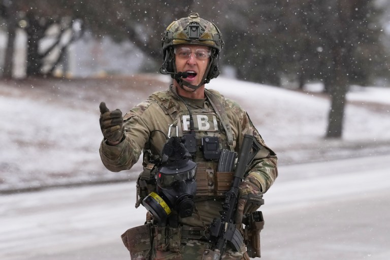 An FBI officer works a scene.